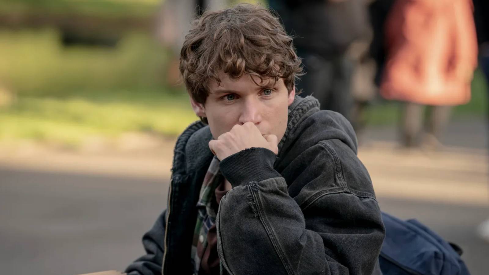 Guy with his hand over his mouth looking worried in Talamasca The Secret Order