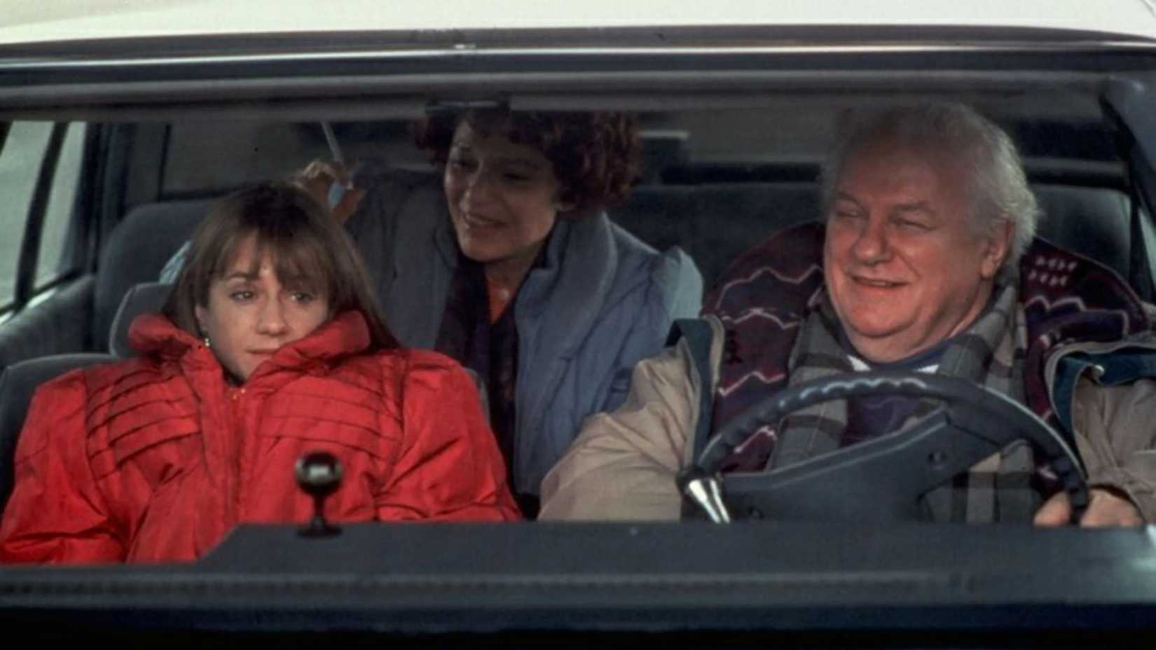 Holly Hunter as Claudia Larson with her mom and dad in Home for the Holidays