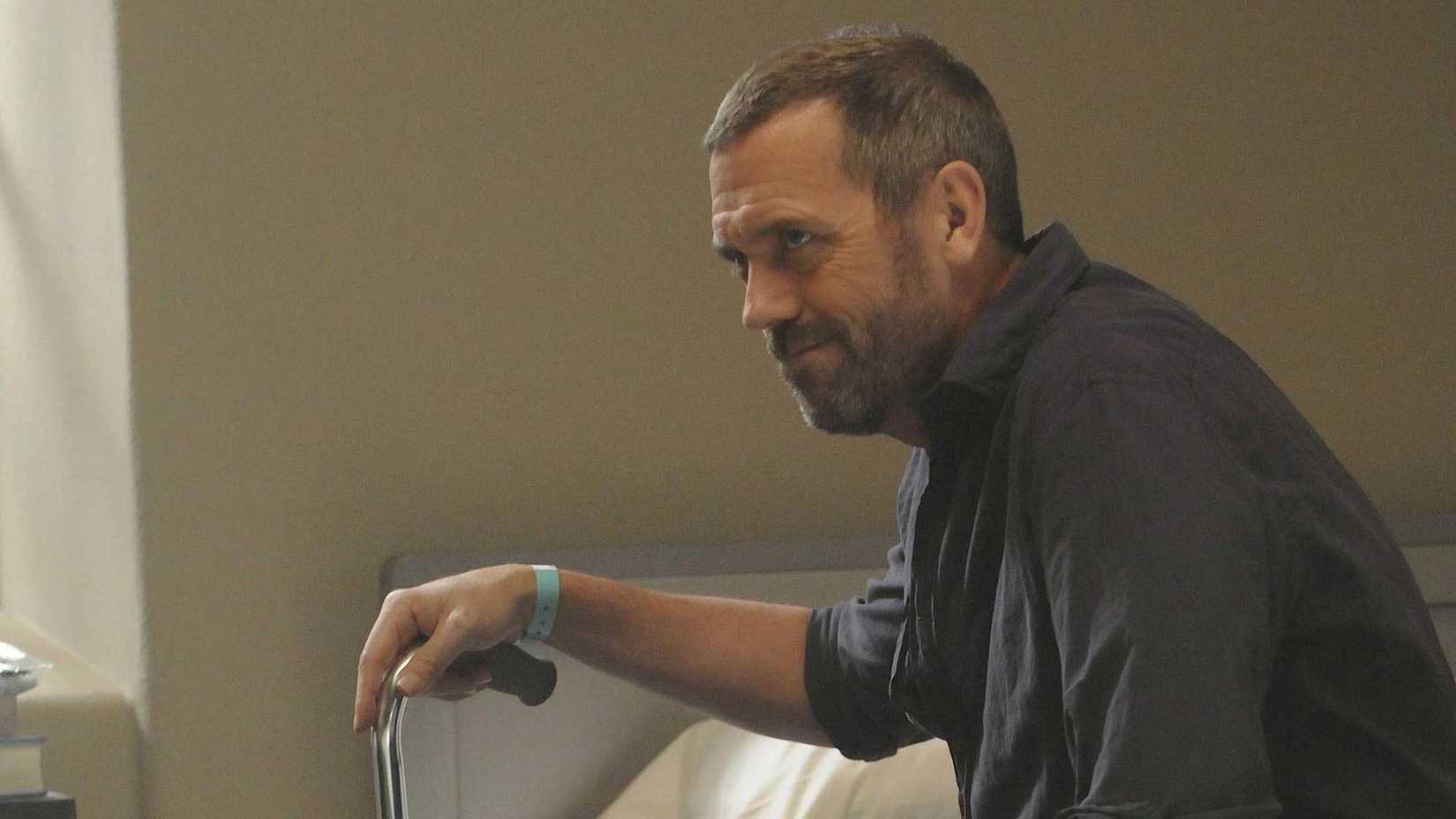 Hugh Laurie as Gregory House smiling in House, M.D. season 6 ep1