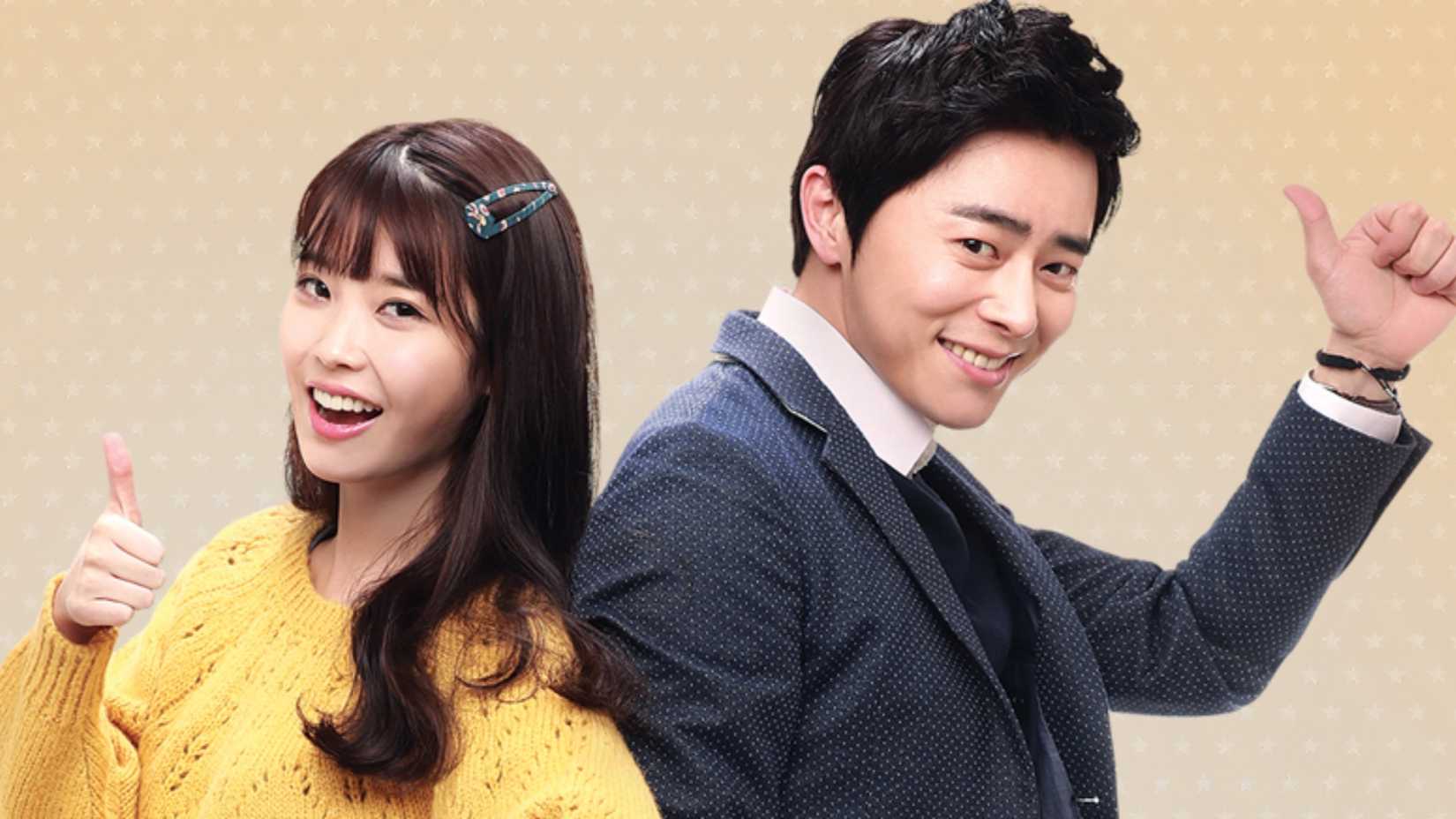 Um homem e uma mulher fazendo sinal de positivo em You're The Best!.