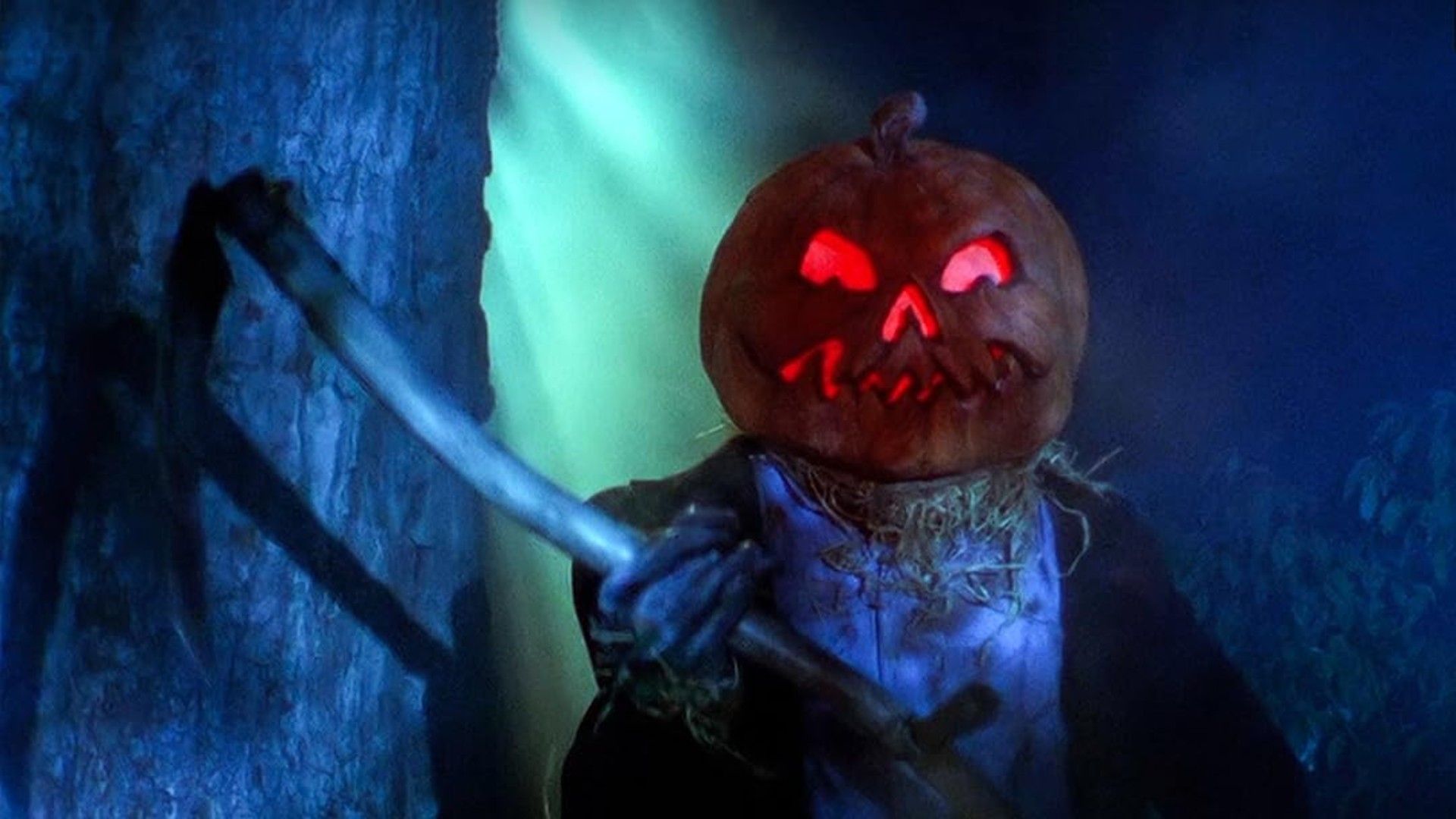 Jack-O holds a scythe with glowing eyes in Jack-O