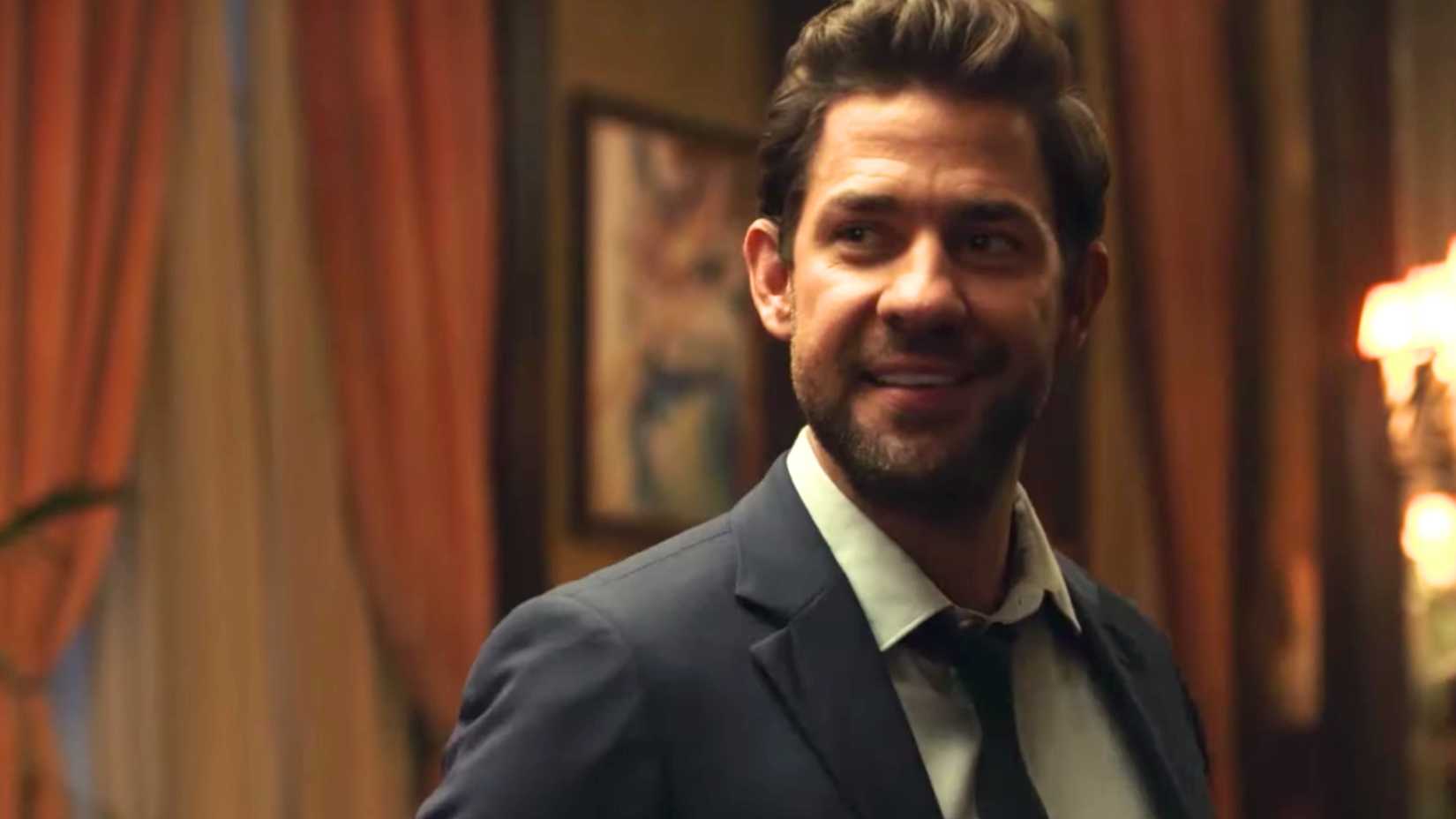 john krasinski grinnign as jack ryan in the amazon prime video show