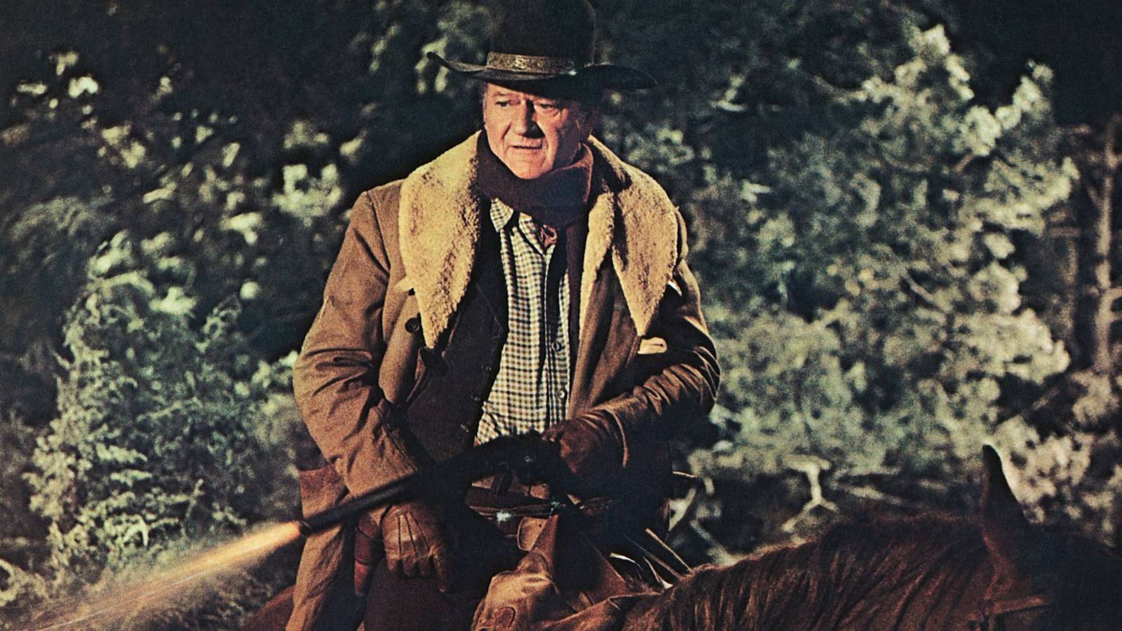 John Wayne as US Marshal JD Cahill on horseback