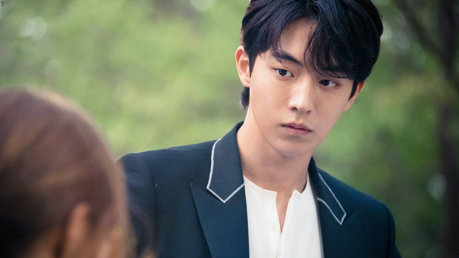 Nam Joo-hyuk looking at a brunette woman.