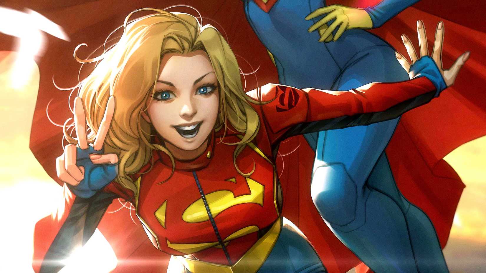 Kara Danvers aka Supergirl throws a peace sign next to Superwoman in DC Comics art