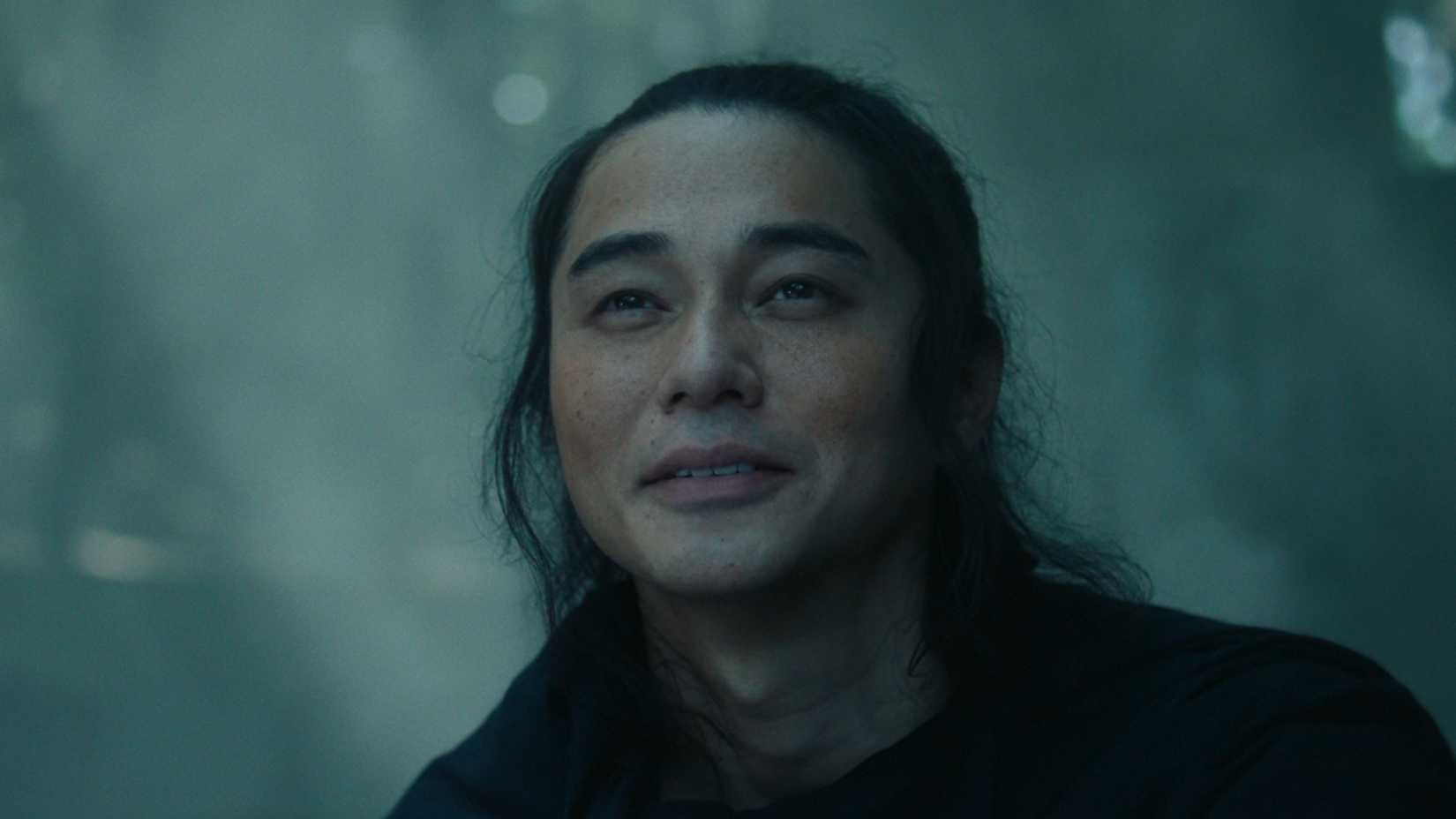 Kyojin smiling in a forest in Last Samurai Standing