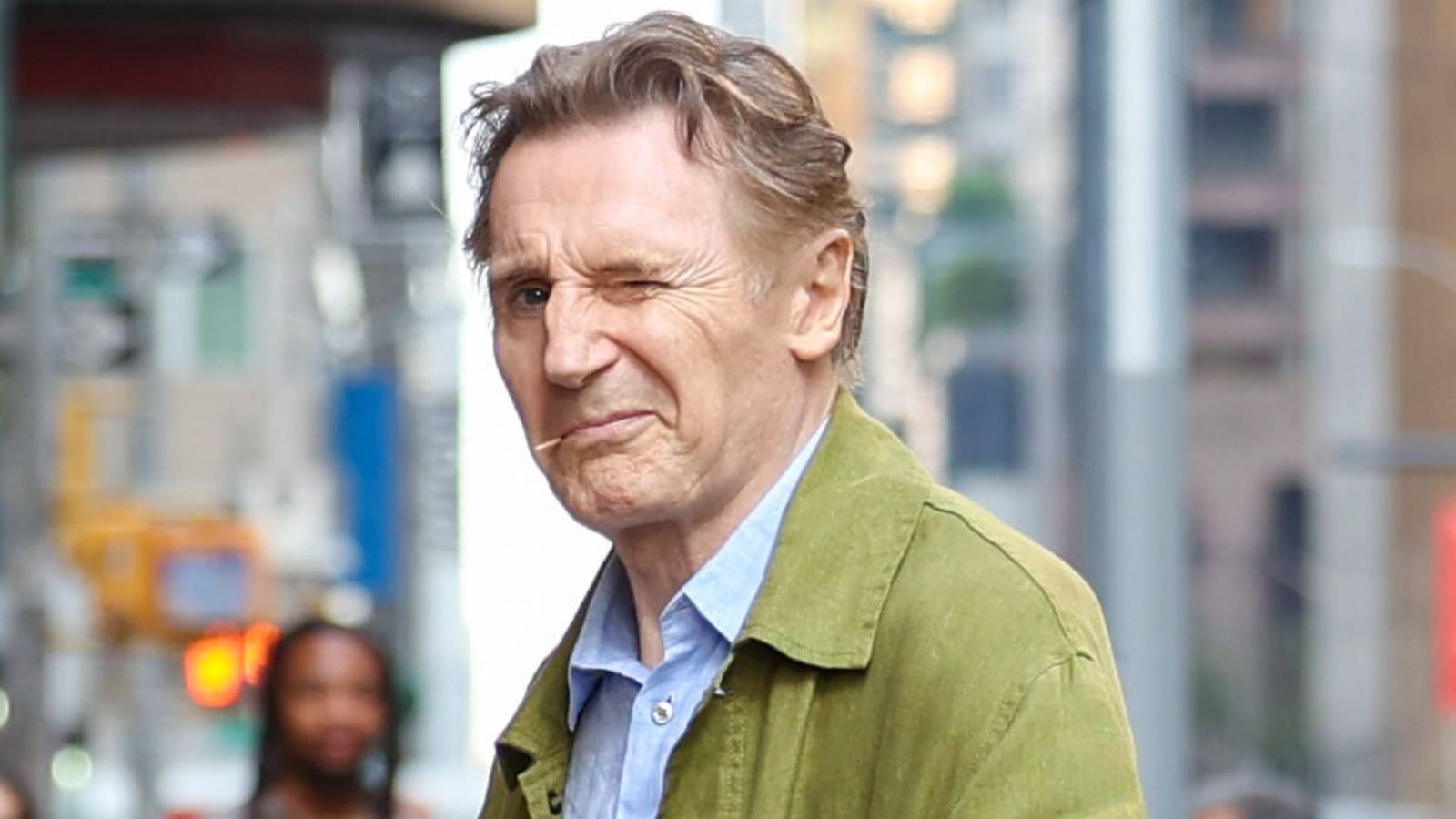 Liam Neeson winking at the camera