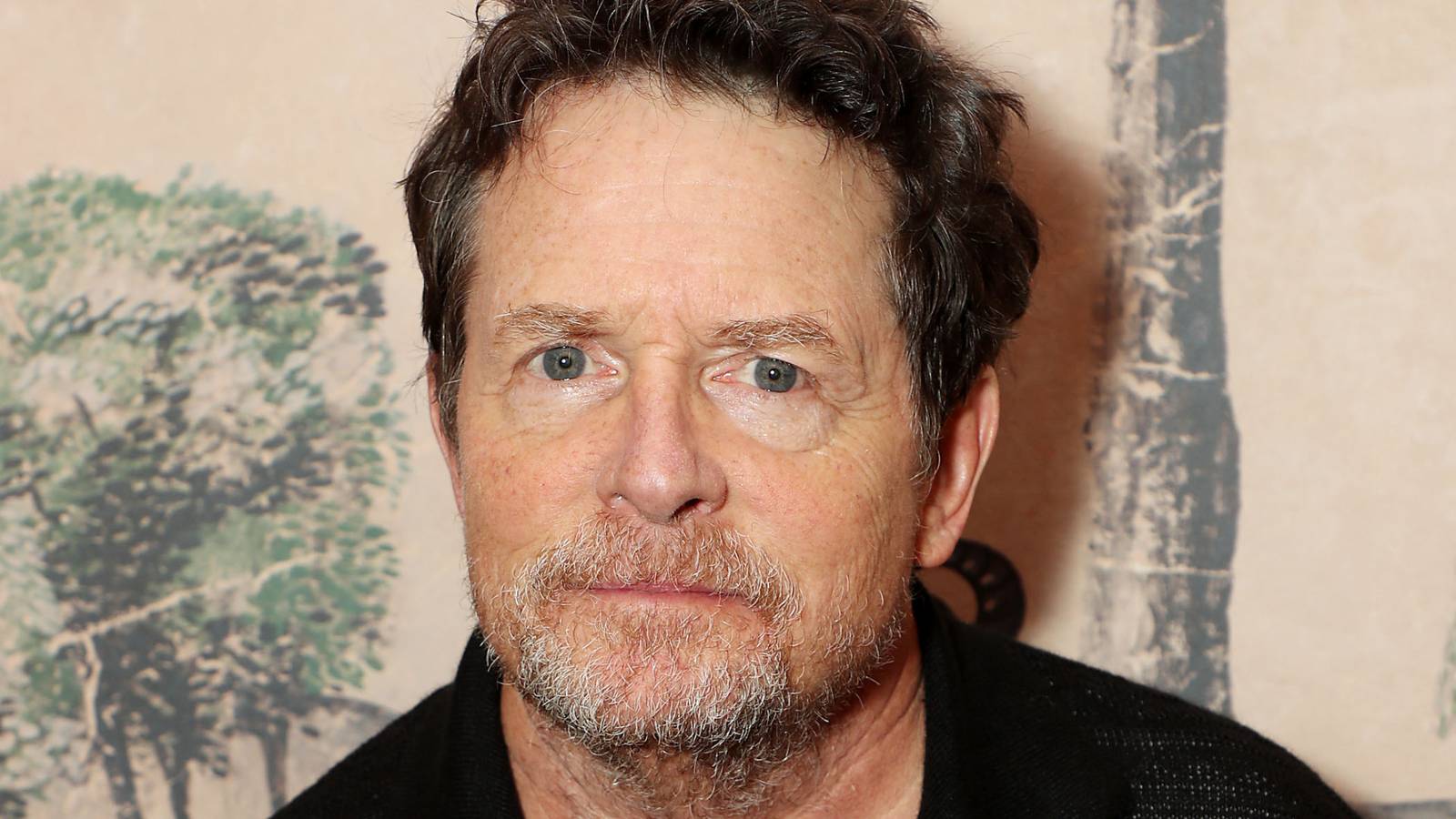 Michael J. Fox looking at the camera during an event in 2023