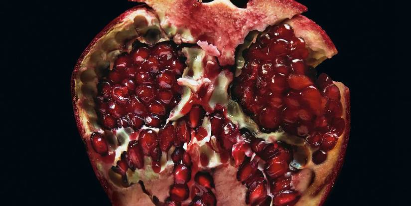 Midnight Sun book cover has a pomegranate cut in half