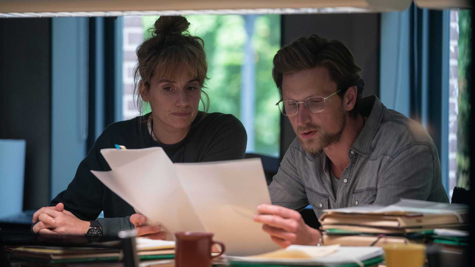 naia and mark reading some documents in the chestnut man