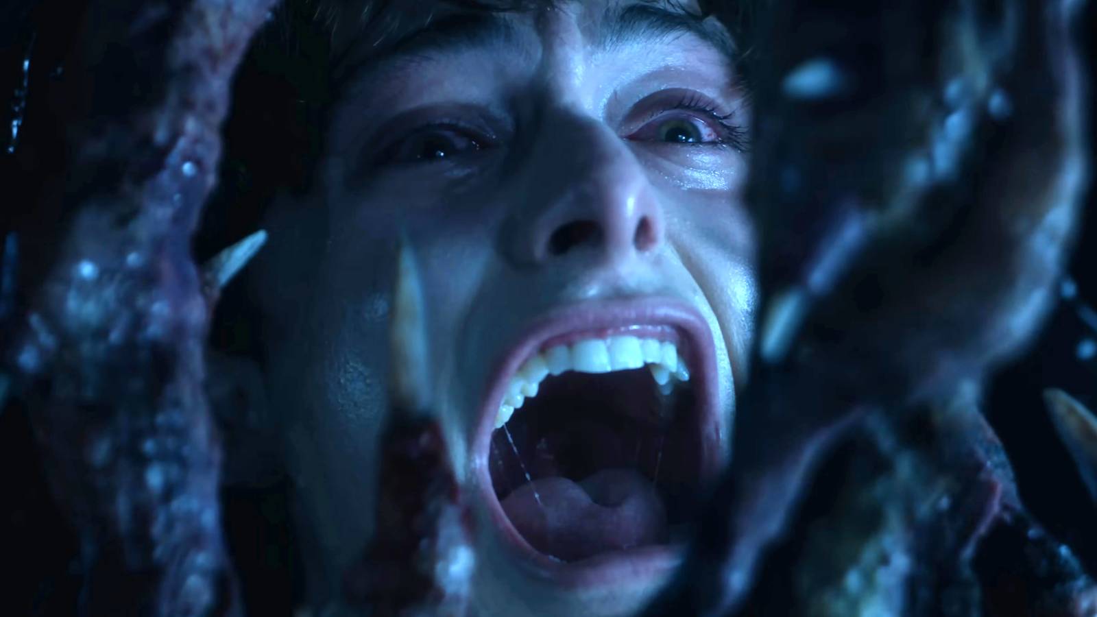 Noah Schnapp as Will screaming with Vecna's hand looming over his face in Stranger Things season 5