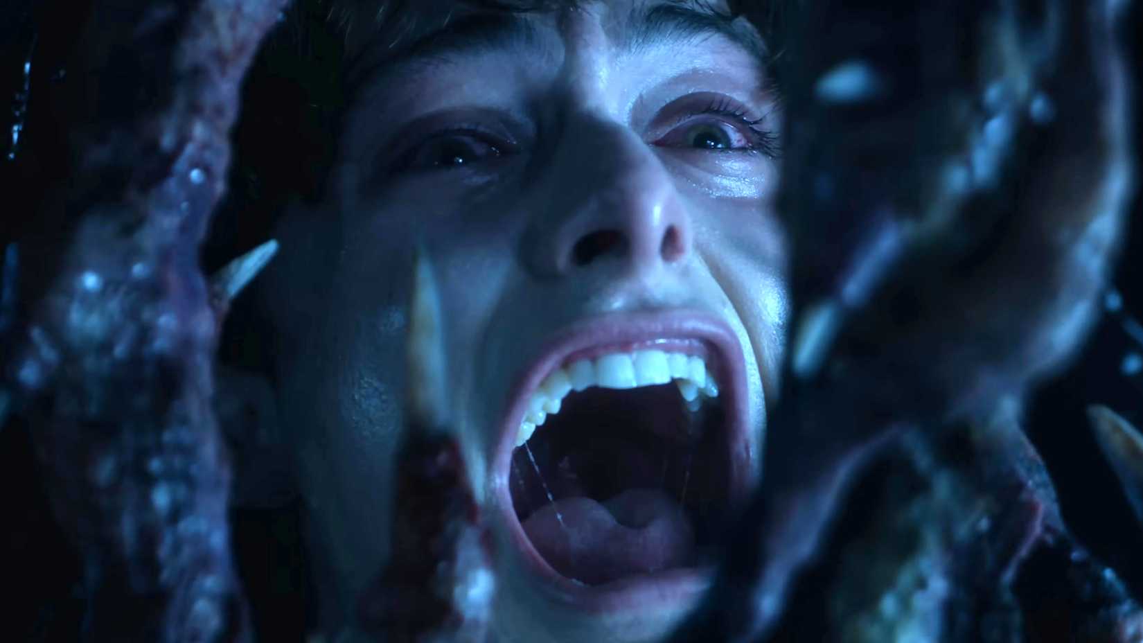 Noah Schnapp as Will screaming with Vecna's hand looming over his face in Stranger Things season 5