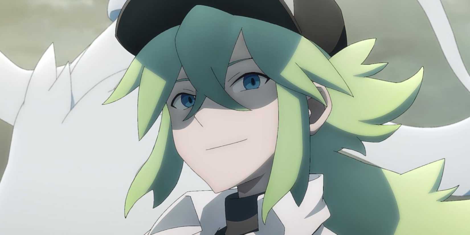N smiles in front of his Reshiram in Pokémon.
