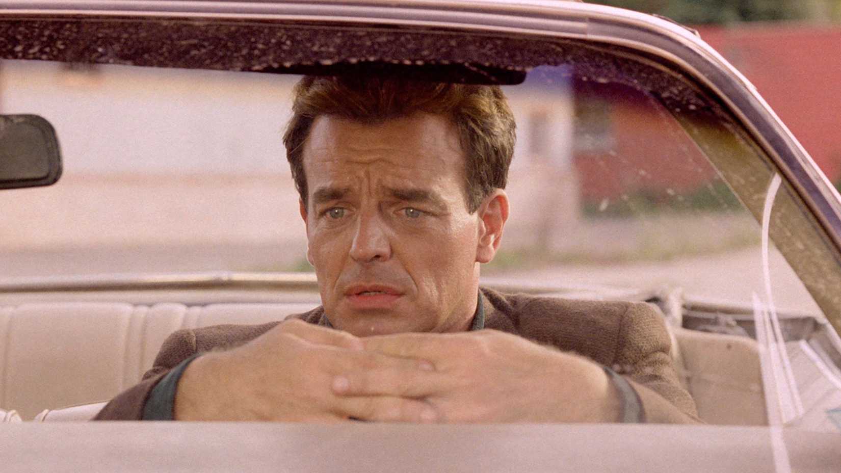 Ray Wise sits in a car looking depressed in a scene from Twin Peaks: Fire Walk With Me
