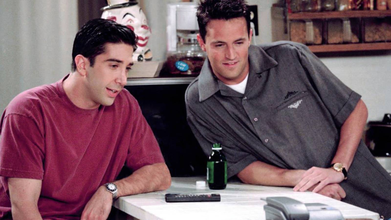 Ross Geller (David Schwimmer) and Chandler Bing (Matthew Perry) staring at something intently in Friends