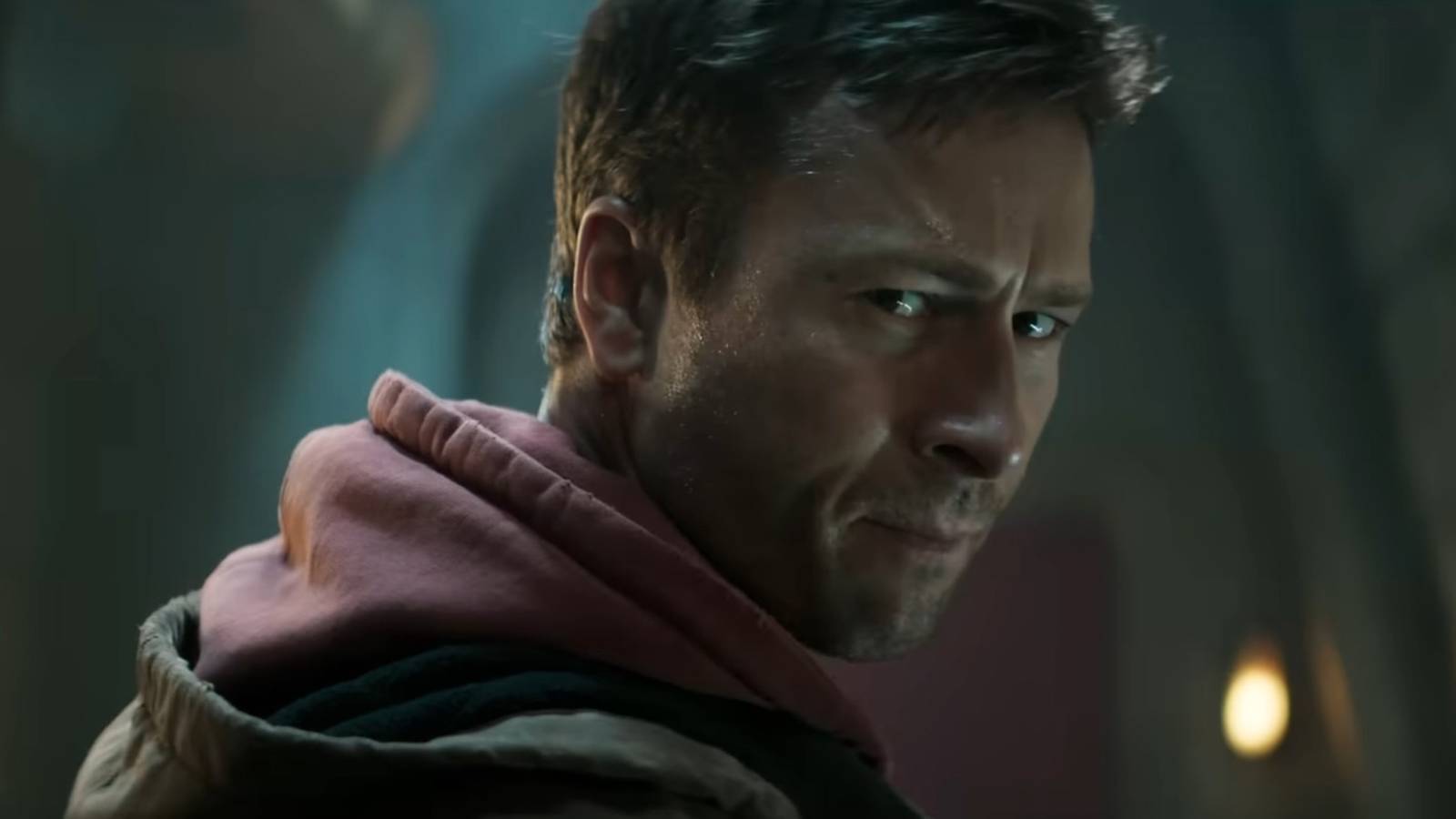 Glen Powell as Ben Richards looks back in The Running Man