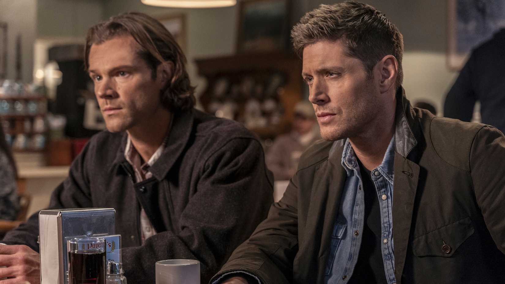 Sam and Dean at a dinner in Supernatural season 15