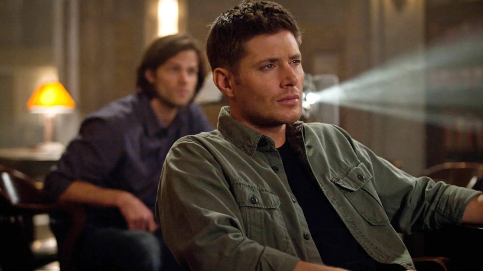 Sam and Dean watching a projector in Supernatural