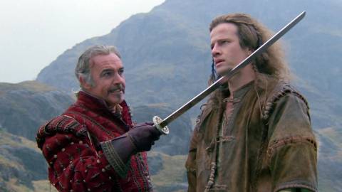 Sean Connery holding a sword to Connor in Highlander