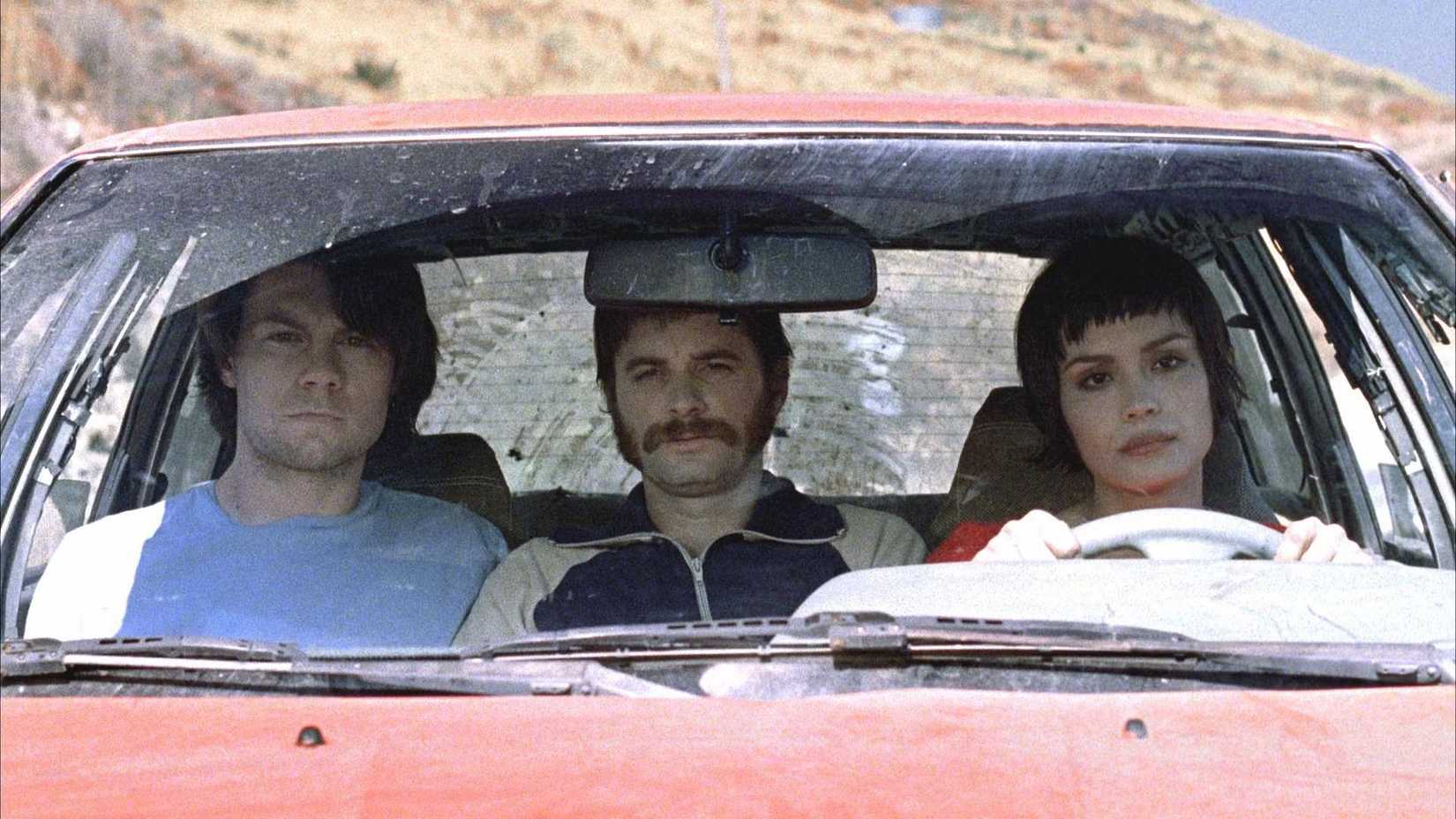Shannyn Sossamon as Mikal driving a car with Patrick Fugit as Zia in Wristcutters a Love Story
