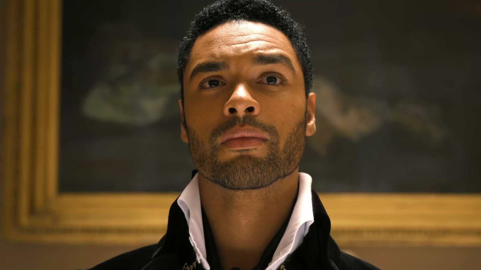 Simon is looking at a painting in Bridgerton