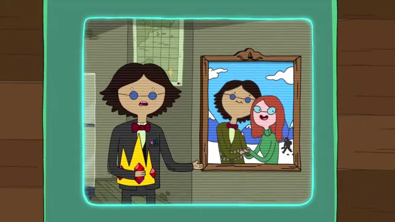 Simon Petrikov, o Rei de Gelo, aponta para uma foto dele e de sua esposa em Hora de Aventura