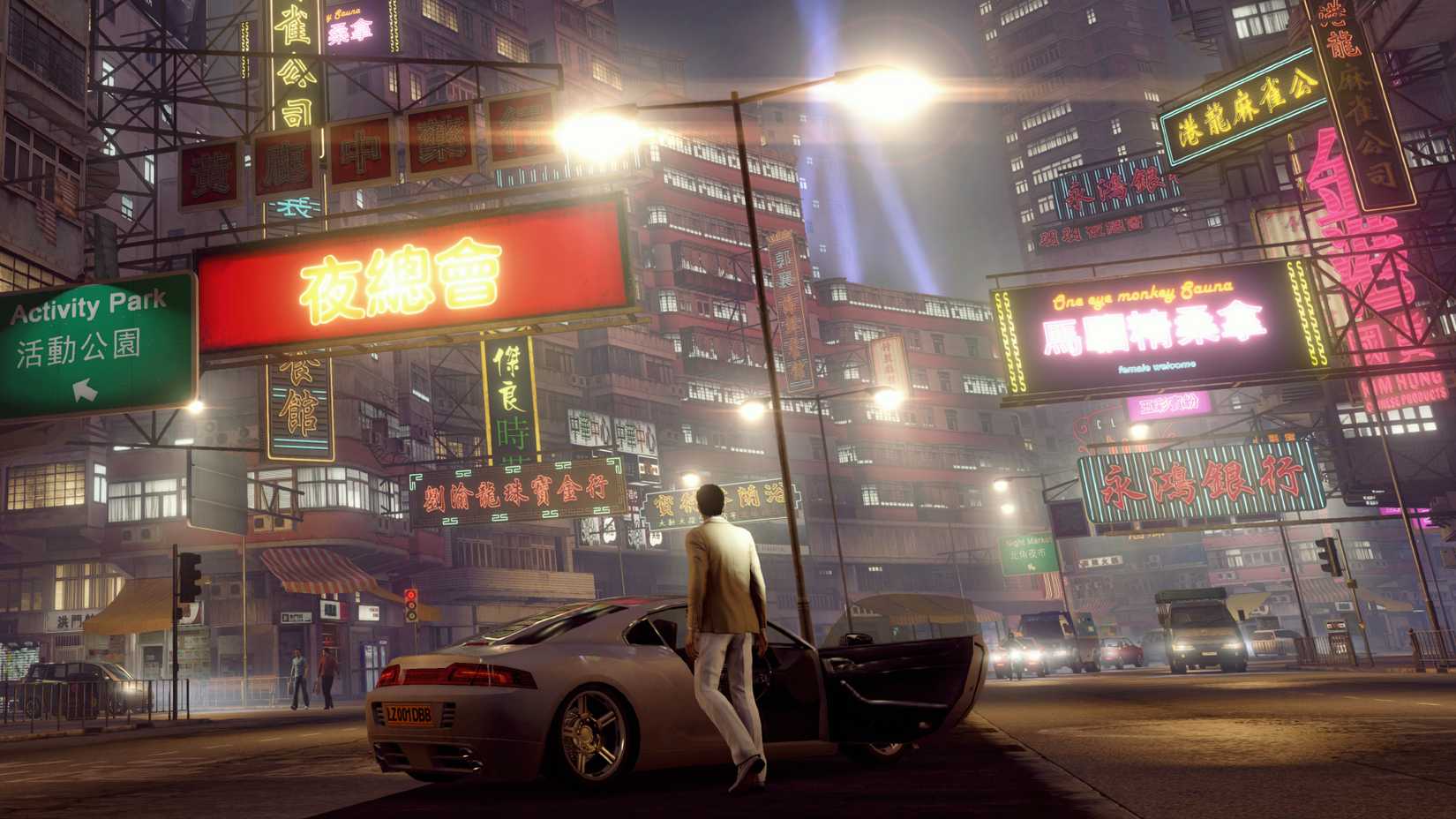 Sleeping Dogs character standing looking out at a neon-lit Hong Kong street