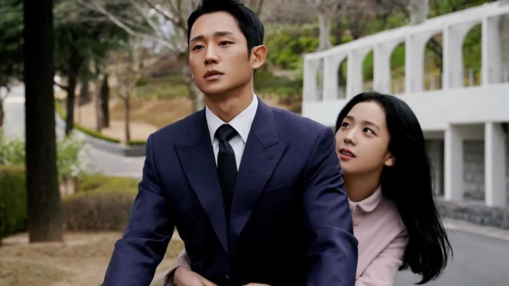 A man and woman riding a bike together in the K-drama Snowdrop.