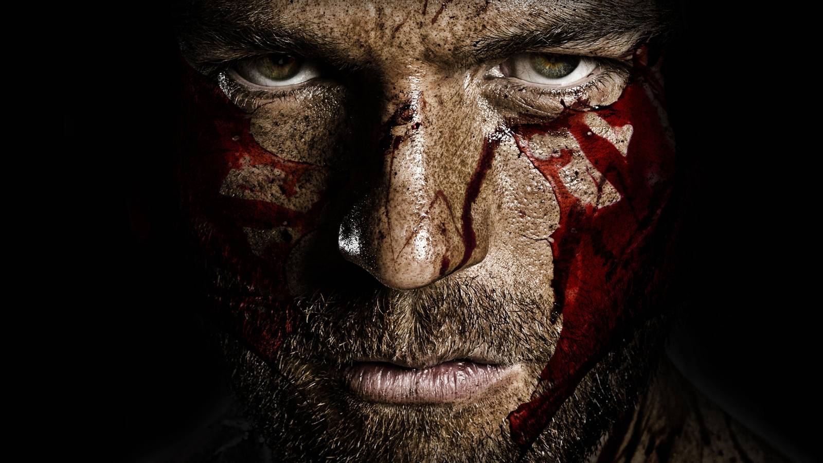 Liam McIntyre as Spartacus covered in blood in Spartacus Starz series