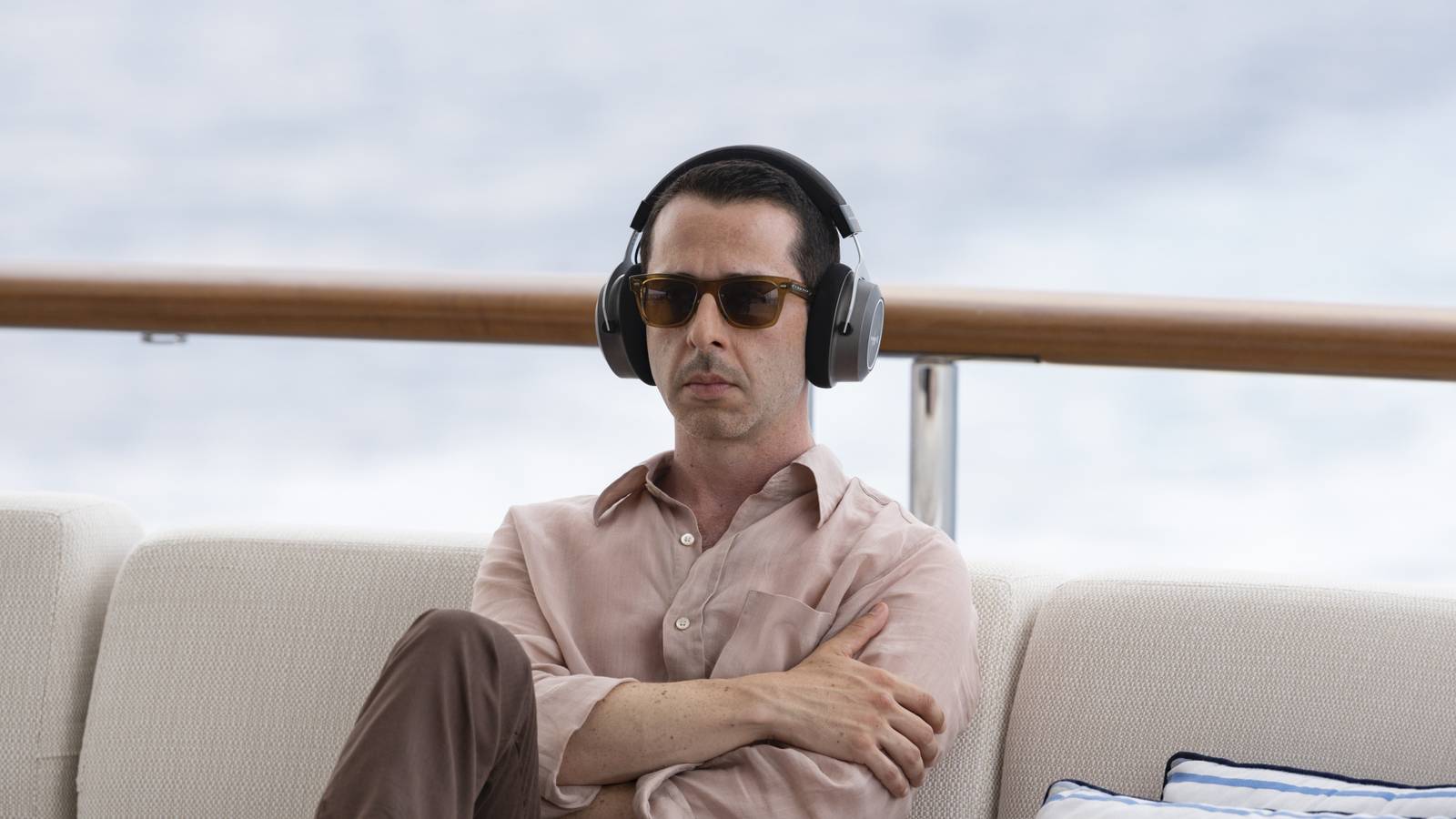 Jeremy Strong as Kendall Roy with headphones and sunglasses on in Succession