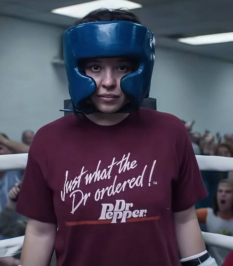 Sydney Sweeney's Christy looking into the camera while wearing boxing training gear in Christy