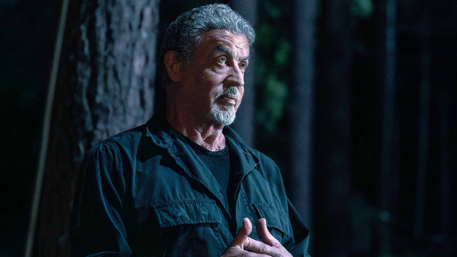 Sylvester Stallone's Manfredi looking angry with his hands swirling each other in Tulsa King season 3