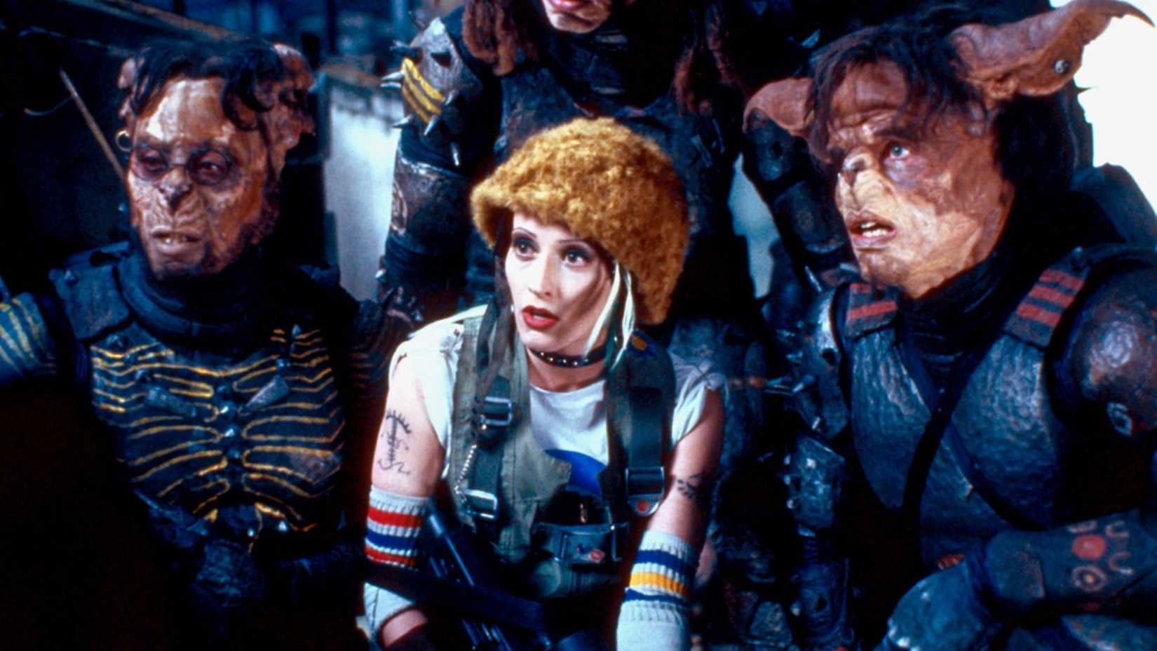 Tank Girl and two kangaroos look on in Tank Girl