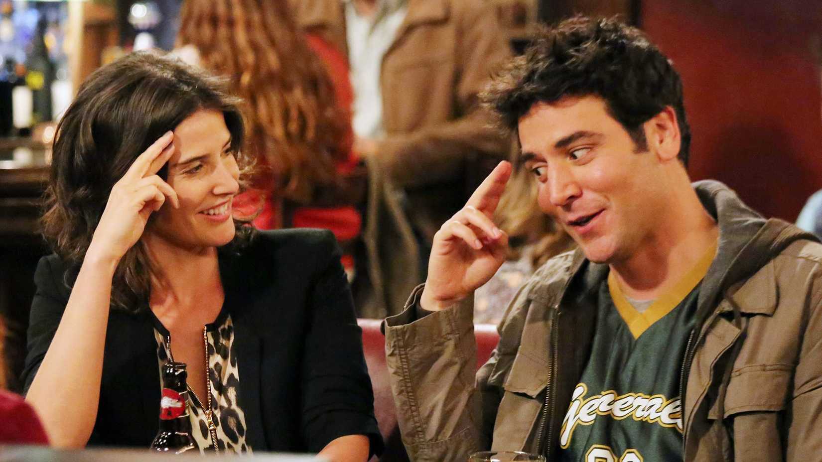 Cobie Smulders and Josh Radnor as Robin and Ted saluting in How I Met Your Mother