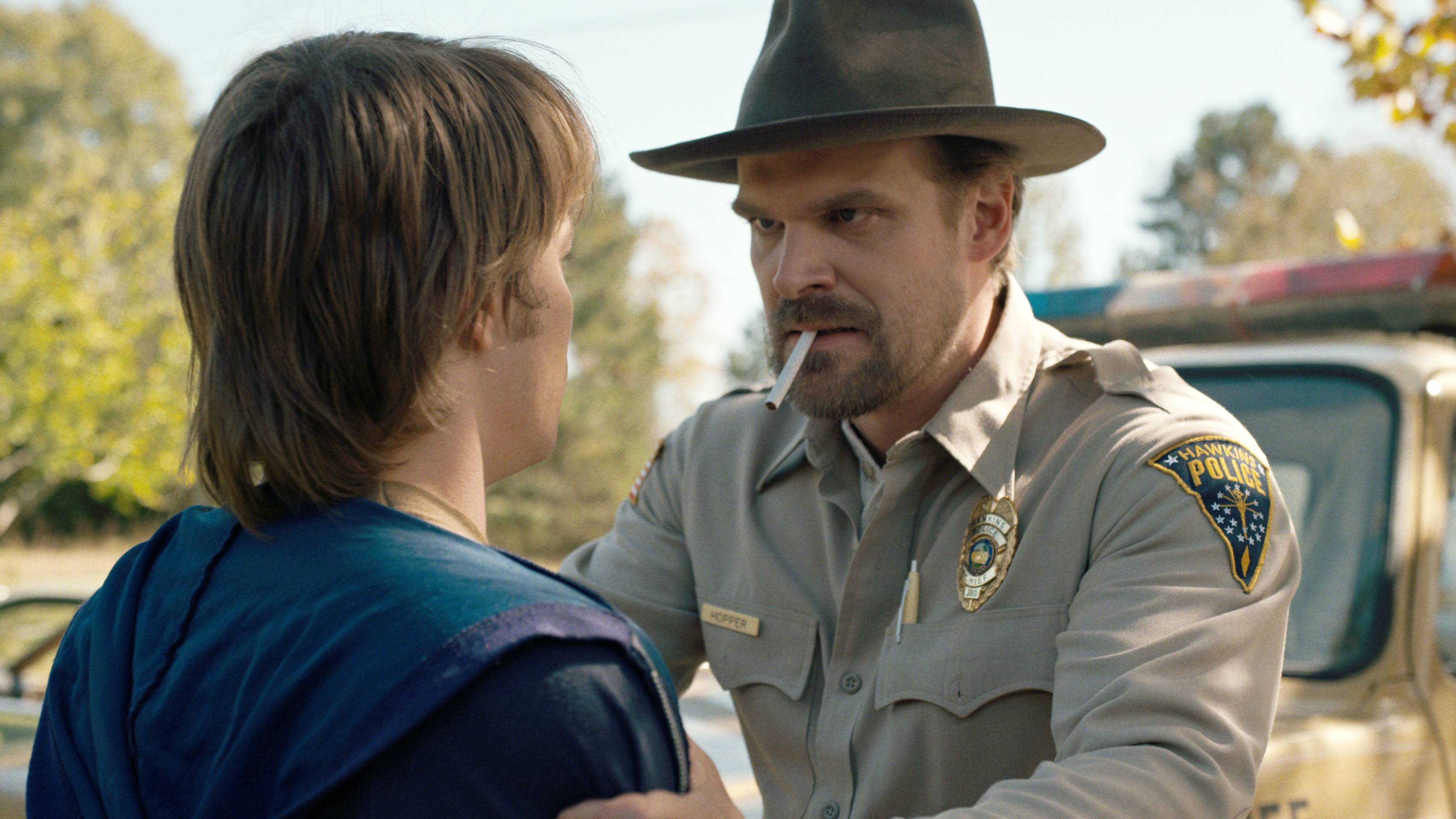 Jim Hopper (David Harbour) grabbing Jonathan's (Charlie Heaton) shoulders in Stranger Things season 1