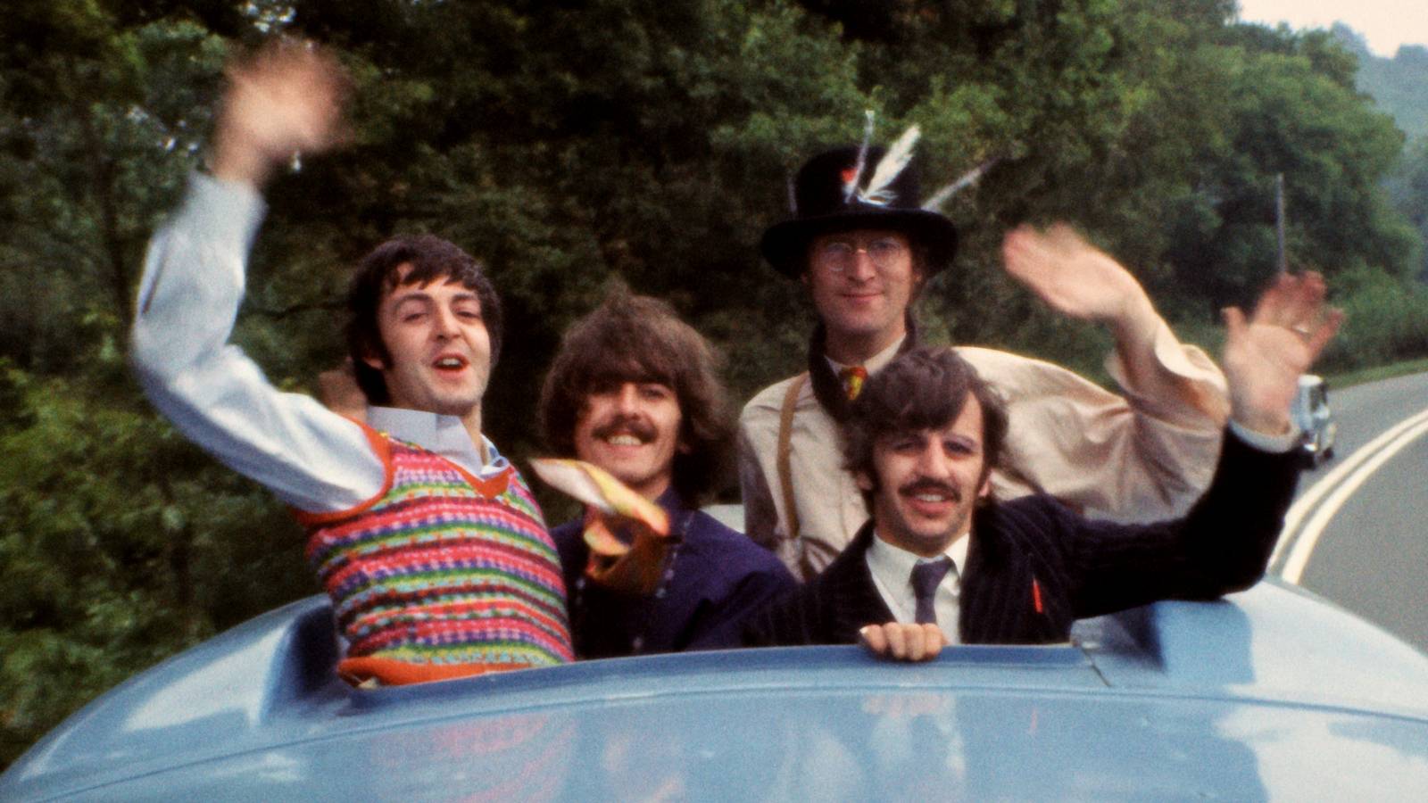 The Beatles waving out of the top of the Magical Mystery Tour bus in The Beatles Anthology 2025