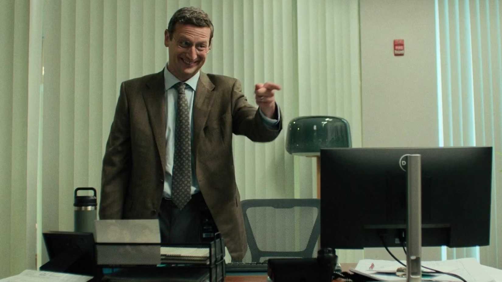 Tim Robinson points in The Chair Company