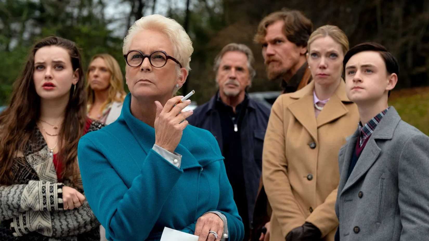 The family in Knives Out looking at the home