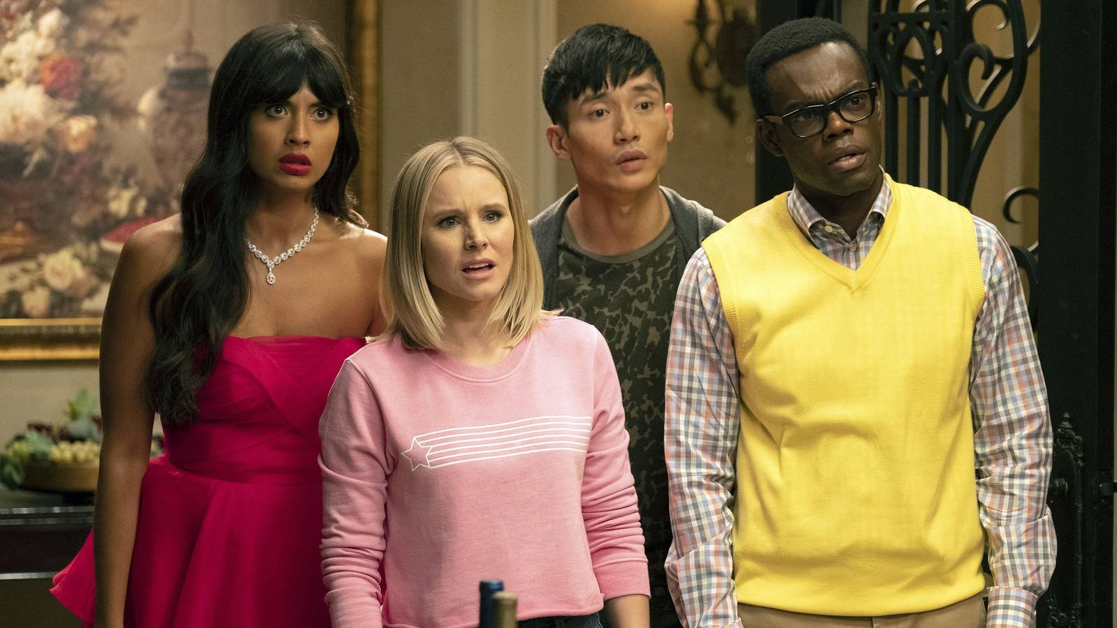 Jason, Eleanor, Tahani, and Chidi standing together looking confused in The Good Place