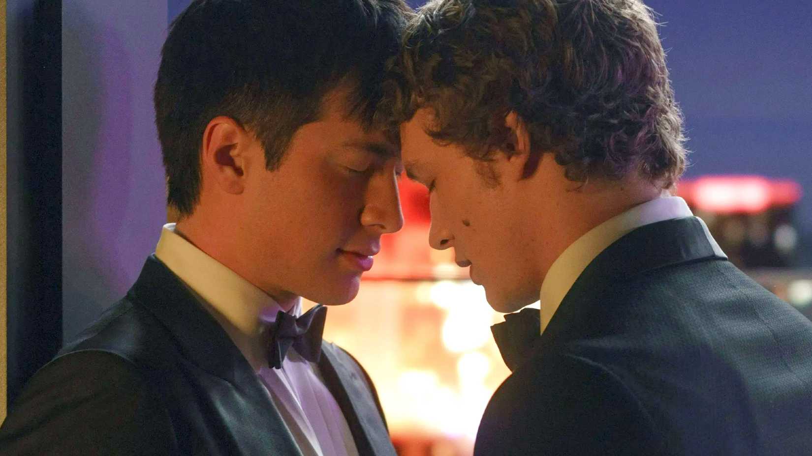 The leads of Heated Rivalry pressing their foreheads together