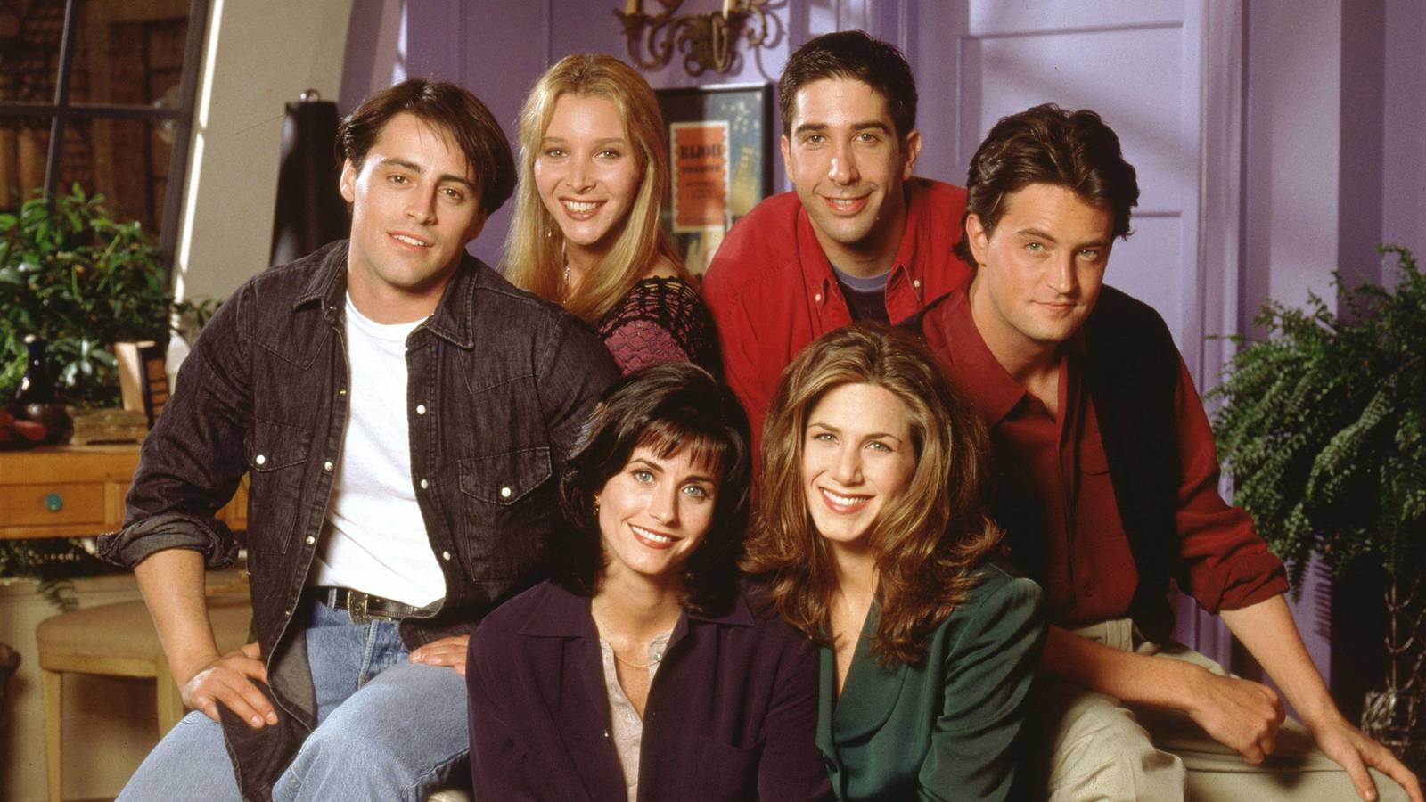 The main cast of Friends at Monica's living room in a promo photo for Friends