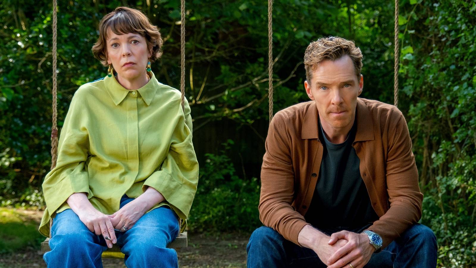 Olivia Colman and Benedict Cumberbatch sitting next to each other looking unhappy in The Roses