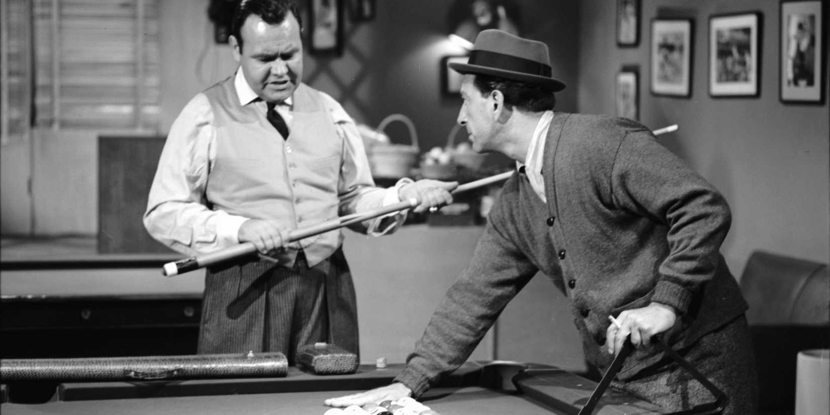 Jesse (Jack Klugman) playing pool while James Fats Brown (Jonathan Winters) watches in The Twilight Zone A Game of Pool.