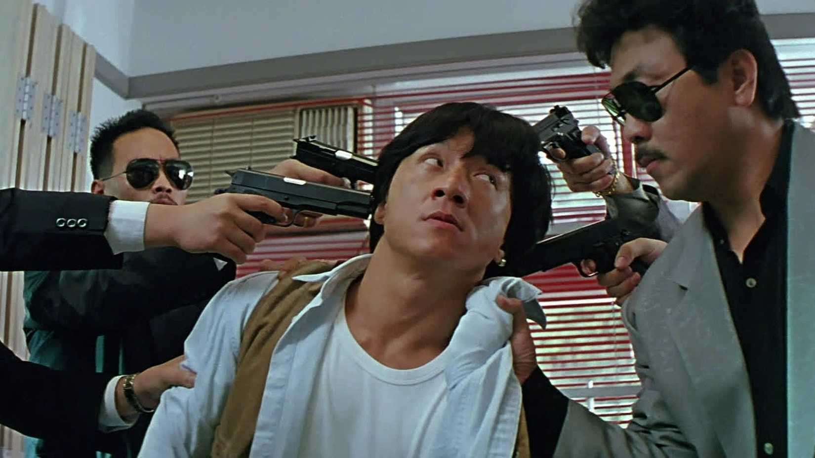 Gangsters point multiple guns at Jackie Chan in Twin Dragons