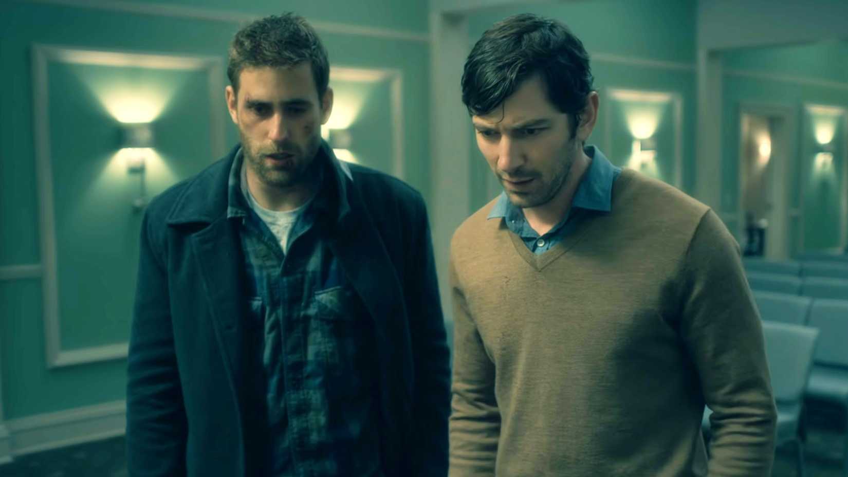 Two characters from Haunting of Hill House looking scared