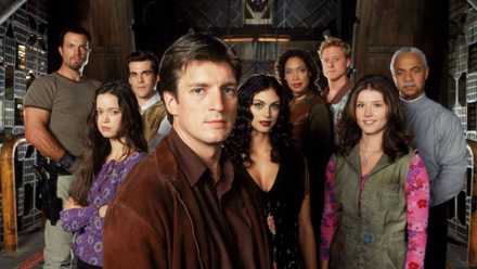 Mal with the rest of the Firefly cast behind him