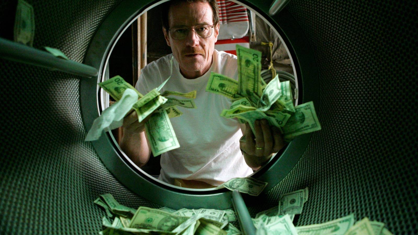 Walter White (Bryan Cranston) staring at money in a washing machine in Breaking Bad