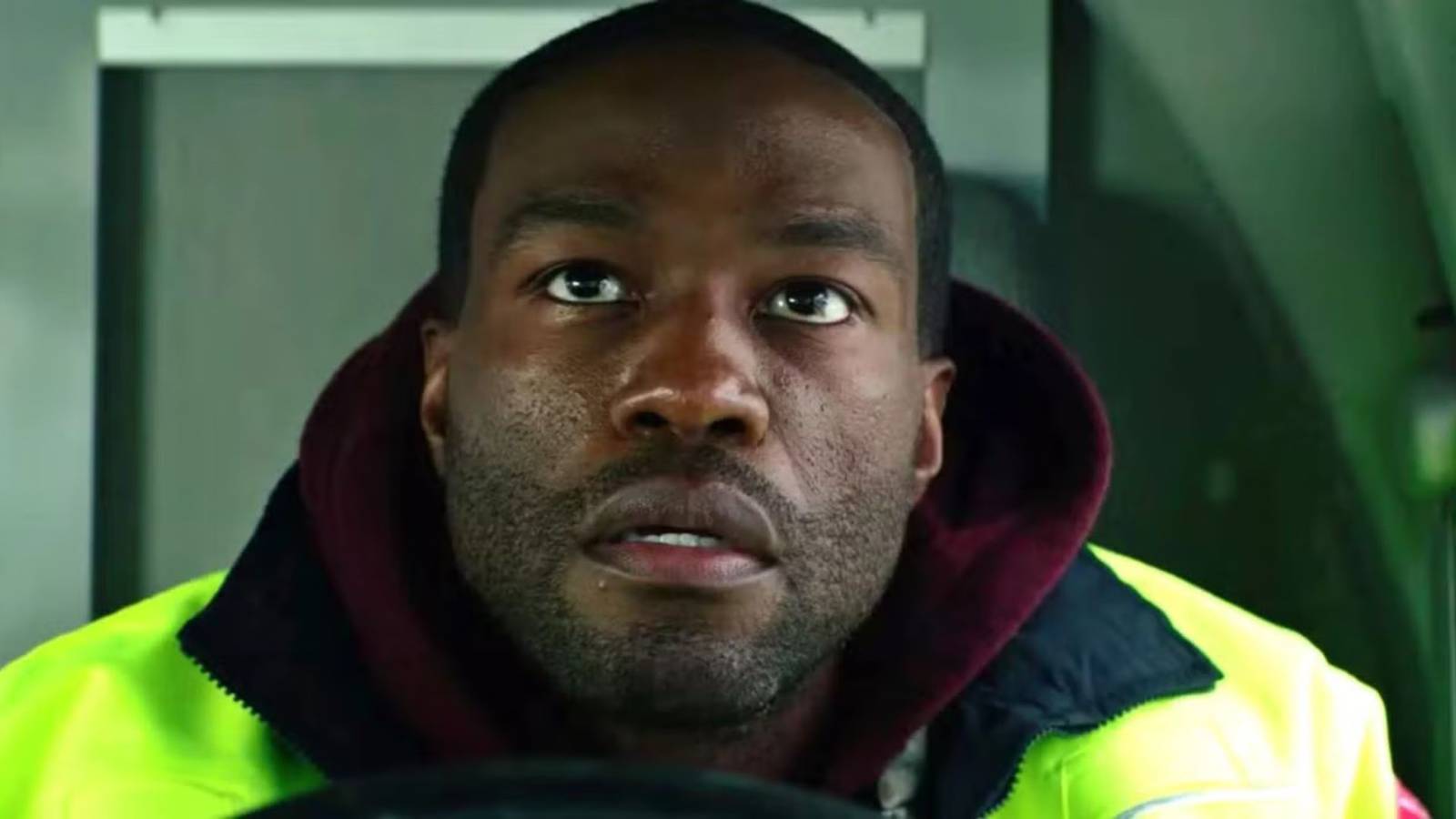 Yahya Abdul-Mateen II leaning forward over the driver's wheel in Ambulance