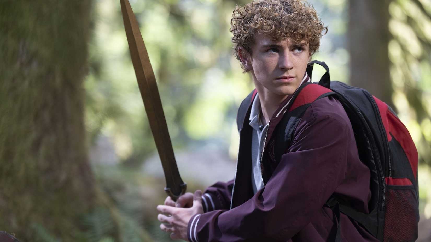 Percy holds up riptide in Percy Jackson & The Olympians season 2.