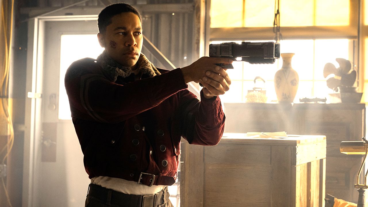 Aaron Moten as Maximus aiming a pistol at someone in Fallout season 2